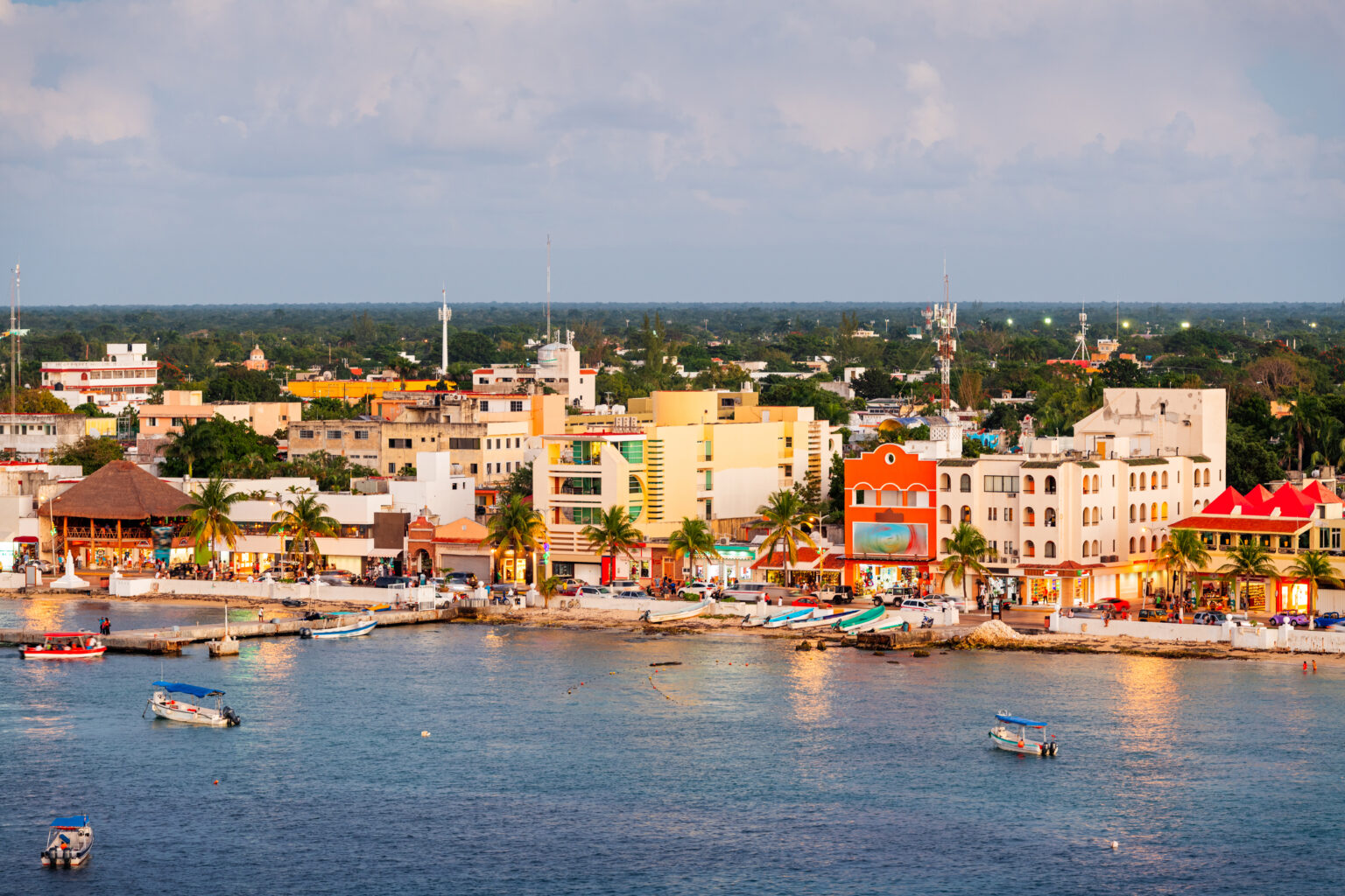 Cozumel, Mexico coastal town skyline at dusk.